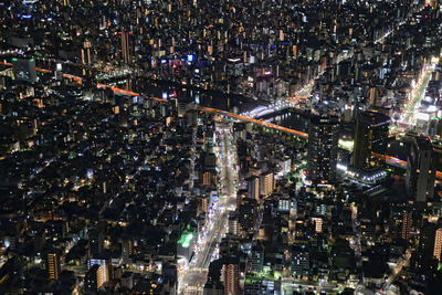 Aerial view of illuminated cityscape at night