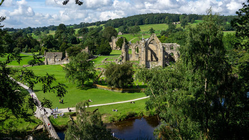 Panoramic view of trees and buildings against sky