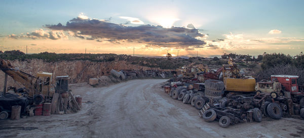 Empty road amidst dumpyard