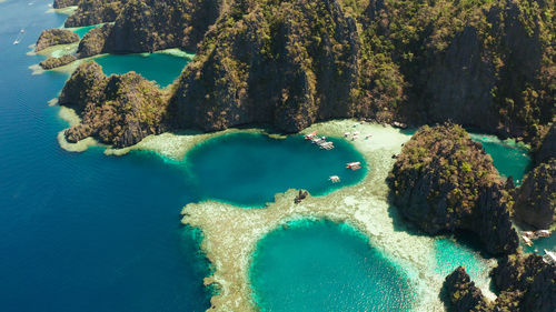 Lagoons and coves with blue water among the rocks. lagoon, mountains covered with forests.