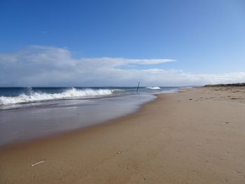 Scenic view of beach against sky