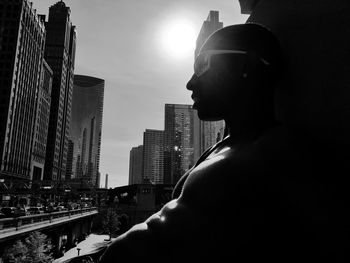 Low angle view of statue against buildings