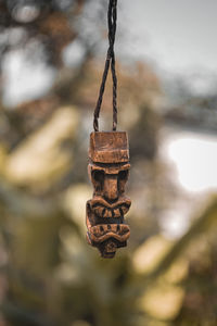 Close-up of rusty chain against wall