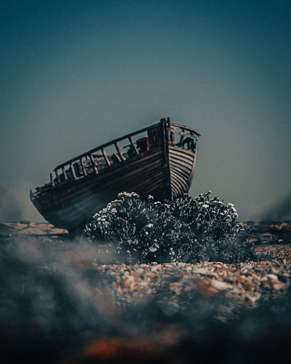 ABANDONED BOAT AGAINST SKY