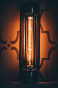 Close-up of illuminated lamp on wall