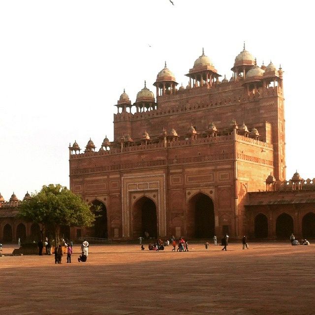 architecture, built structure, building exterior, large group of people, famous place, tourism, history, travel destinations, international landmark, travel, tourist, place of worship, arch, religion, person, men, clear sky, facade, spirituality