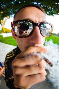 Portrait of young man wearing sunglasses