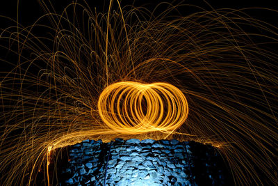 Close-up of illuminated lighting equipment at night