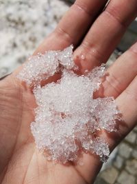 Close-up of hand holding ice cream