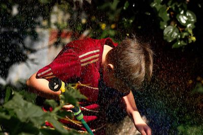 Boy and tree in water