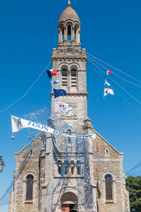 Low angle view of building against blue sky