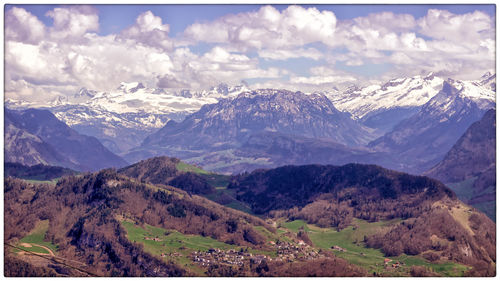Scenic view of snowcapped mountains against sky