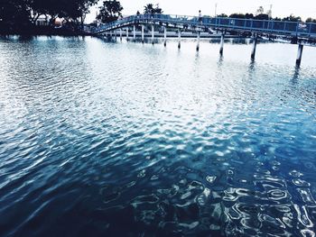 Scenic view of river against blue sky