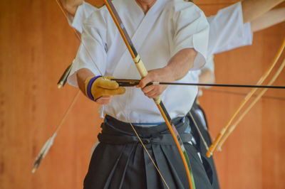 Close-up of man holding umbrella