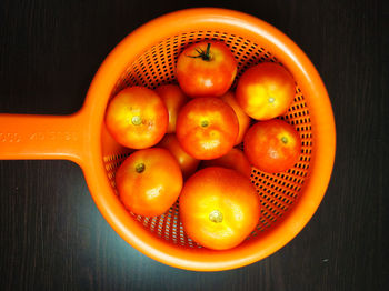 High angle view of oranges in bowl on table