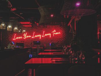 Illuminated electric lamp on table in restaurant