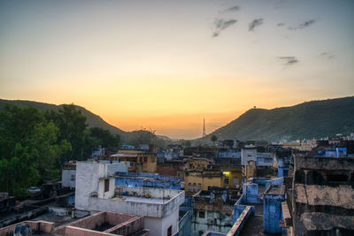 High angle view of townscape against sky during sunset