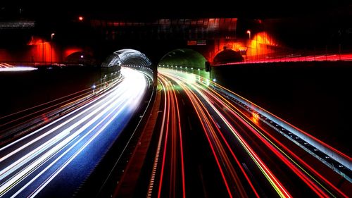 Light trails on road in city at night