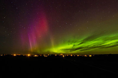 Scenic view of illuminated sky at night