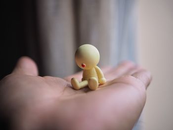 Close-up of hand holding stuffed toy