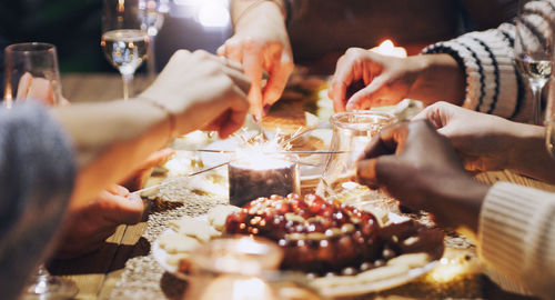 Midsection of woman preparing food at home