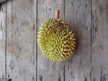 Durian the king of fruits with wooden background.