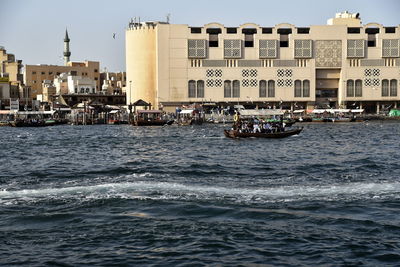 Dubai skyline from dubai creek harbour and dubai canal to downtown and business bay, uae