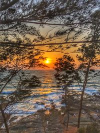 Scenic view of beach against sky during sunset