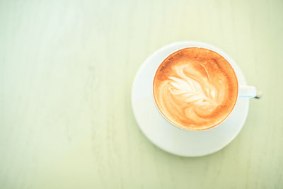Directly above shot of cappuccino on table