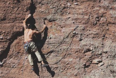 Full length of woman standing on rock