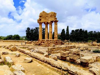 Old ruins of temple against cloudy sky