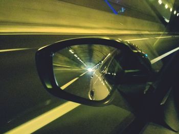 Reflection of car on side-view mirror