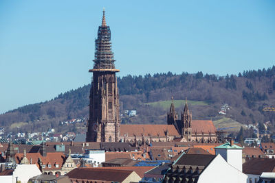 View of buildings in town against sky