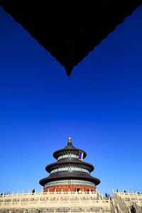 Low angle view of building against blue sky