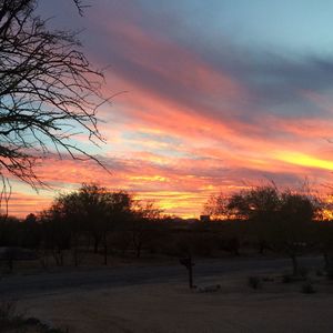 Scenic view of landscape against sky at sunset