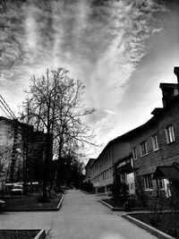 Street amidst buildings against sky