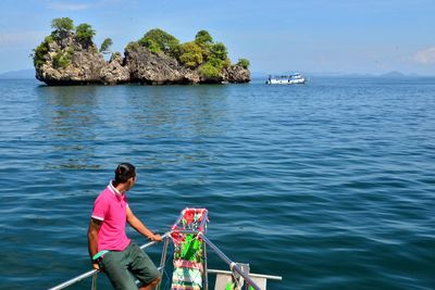 Man on boat in sea