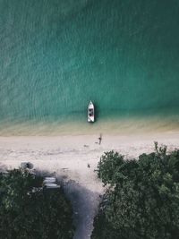 High angle view of boat at beach against sea