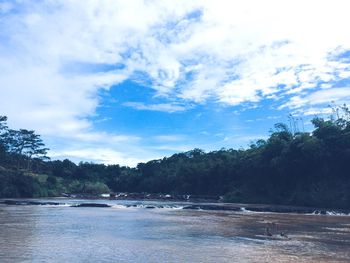 Scenic view of sea against cloudy sky
