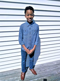 Portrait of smiling boy standing outdoors