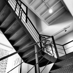 Low angle view of illuminated staircase in building