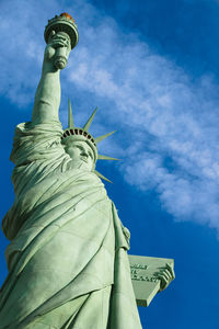 Low angle view of statue against cloudy sky