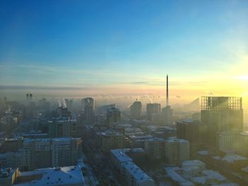 Cityscape against sky during sunset