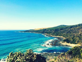 Scenic view of sea against clear blue sky