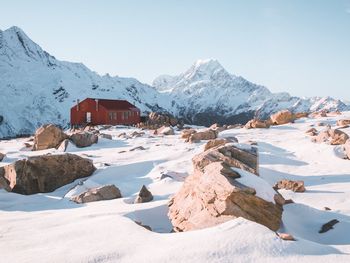 Scenic view of snowcapped mountains against clear sky