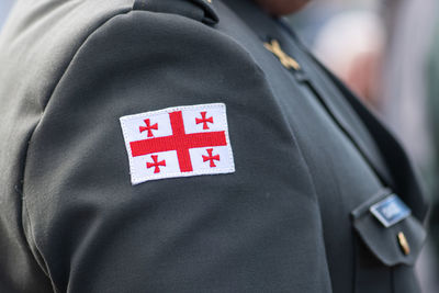 Flag of georgia, georgian army or armed forces on a patch of a soldier military uniform, close up