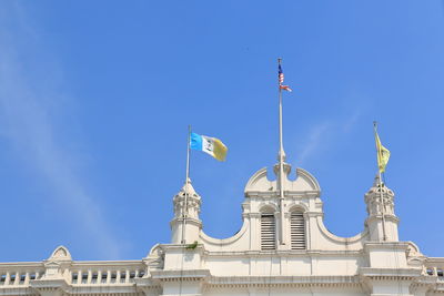 Low angle view of building against blue sky