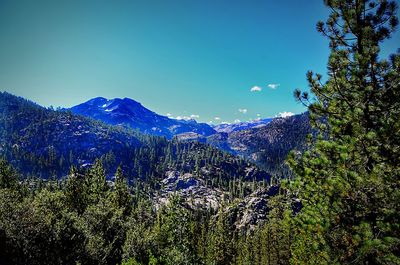 Scenic view of mountains against clear blue sky