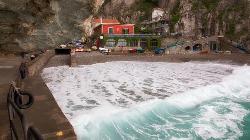 Panoramic view of beach and houses against sky