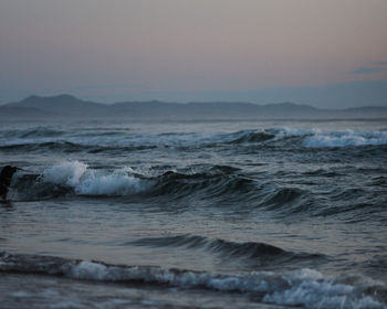 Scenic view of sea against sky at sunset